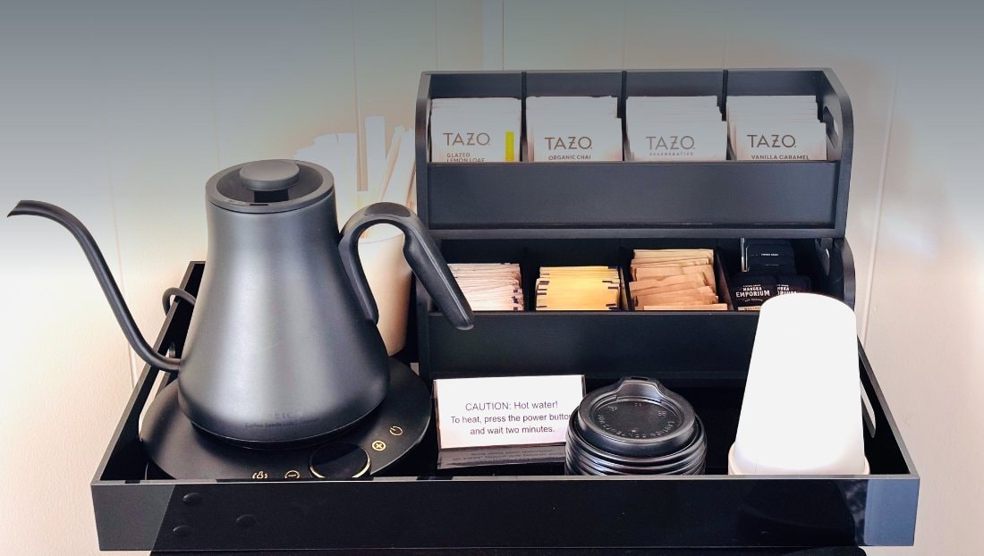 Our tea station — kettle, Tazo teas, honey, and cups
